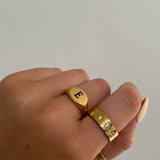Introducing our Staple Signet RIng from our Personalised Collection! All of our pieces are laser engraved- this means it will not fade over time! Available in Gold & Silver. Material: Titanium.