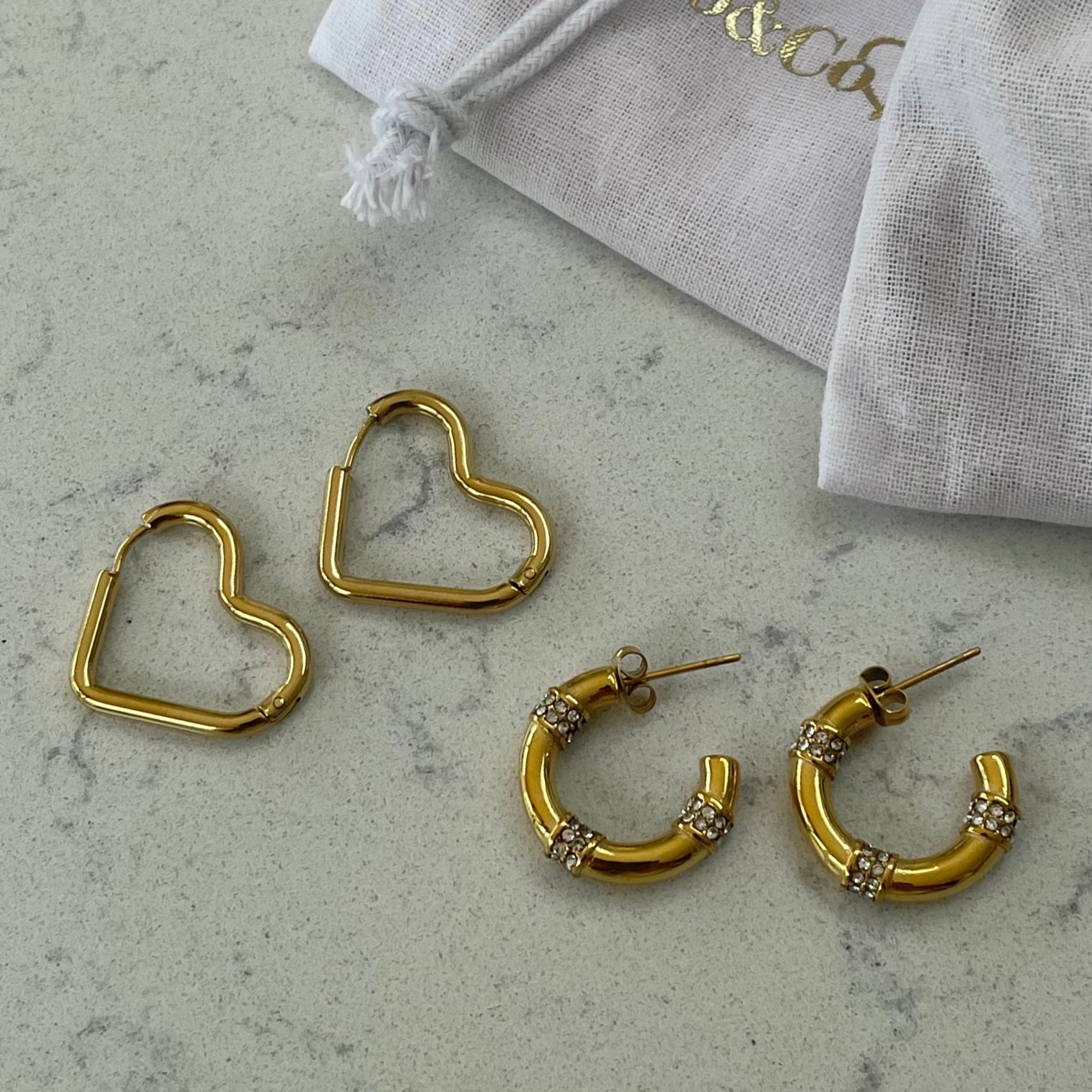 Heart Trendy Hoops.  Available in Gold & Silver.  Material: Titanium. 