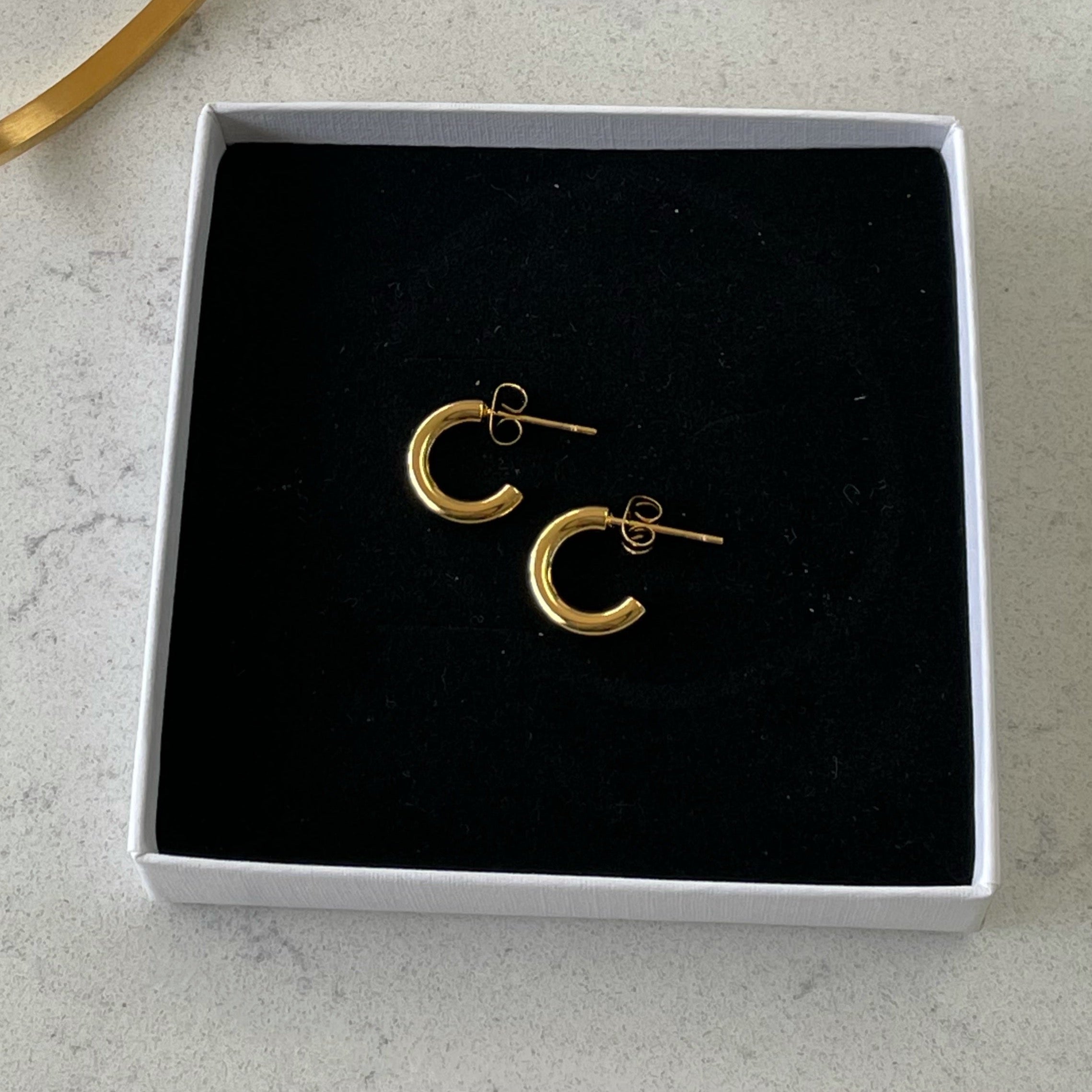 Lola Mini Gold Hoops Mini Gold Hoops. Material: Titanium. ZoandCo Jewellery Dublin Ireland  Edit alt text