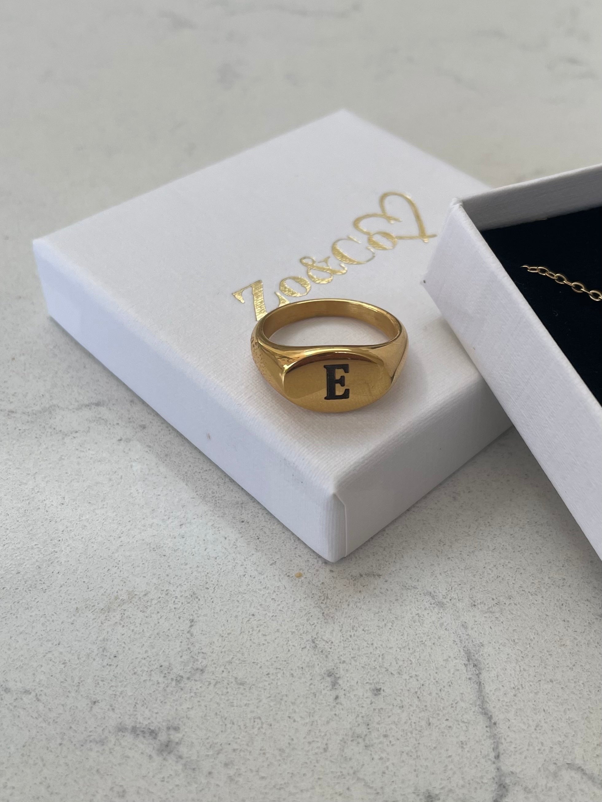 Introducing our Staple Signet RIng from our Personalised Collection!  All of our pieces are laser engraved- this means it will not fade over time!  Available in Gold & Silver.   Material: Titanium. 