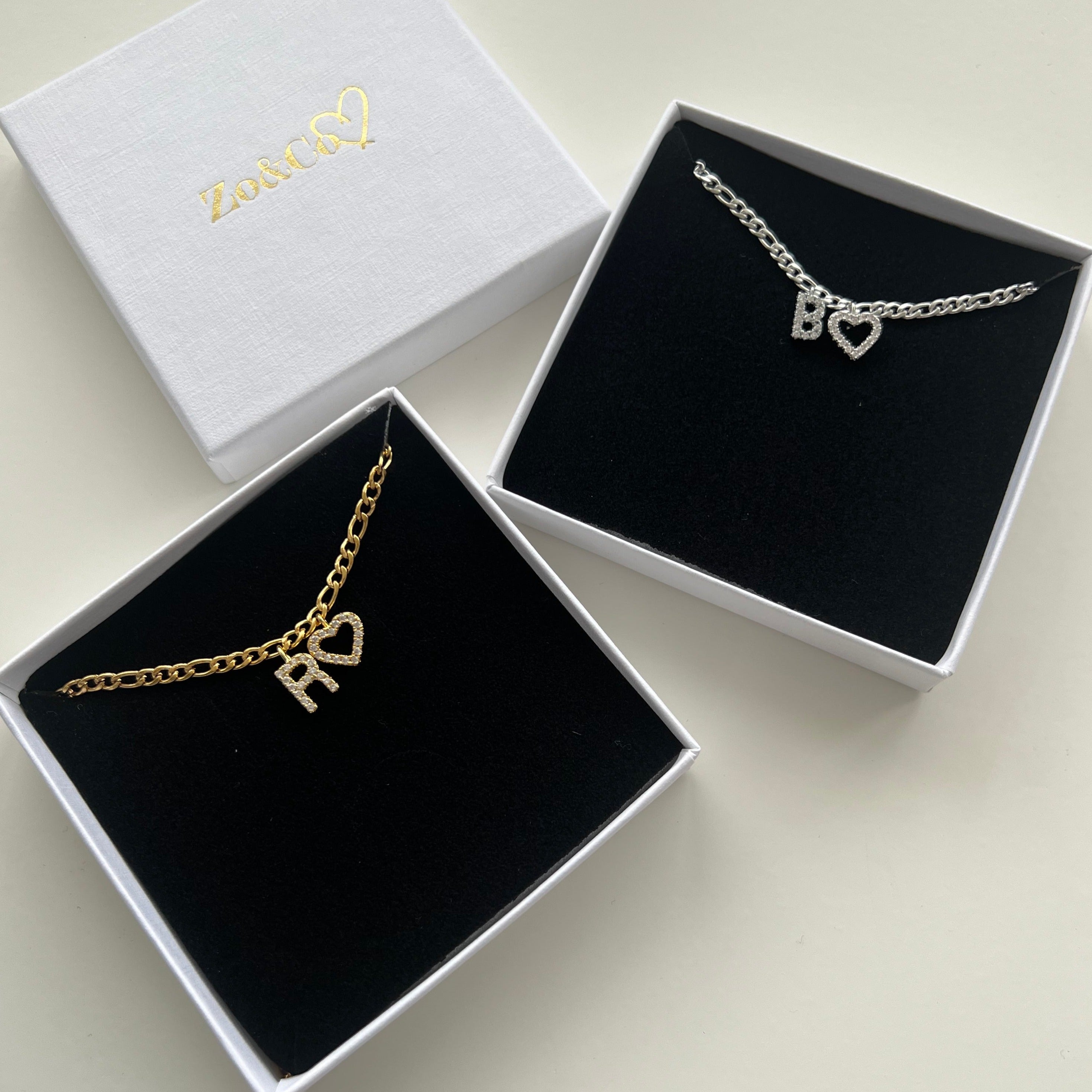 Introducing our Zo&Co Designed Personalised Pendant Initial Pendant with a Heart. The Cutest Necklace to wear by itself or layered together with our Saskia Chain Necklace.  Material: Stainless Steel & Brass.  LEAVE INITIAL ENGRAVING AT THE NOTES SECTION AT CHECKOUT OR YOU CAN EMAIL US.   PERSONALISED PIECES ARE NON RETURNABLE. 